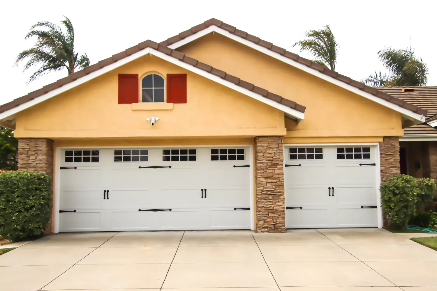 52 Stunning Garage Door Ideas That Will Transform Your Home's Curb Appeal Carriage-Style Roll-Up Doors