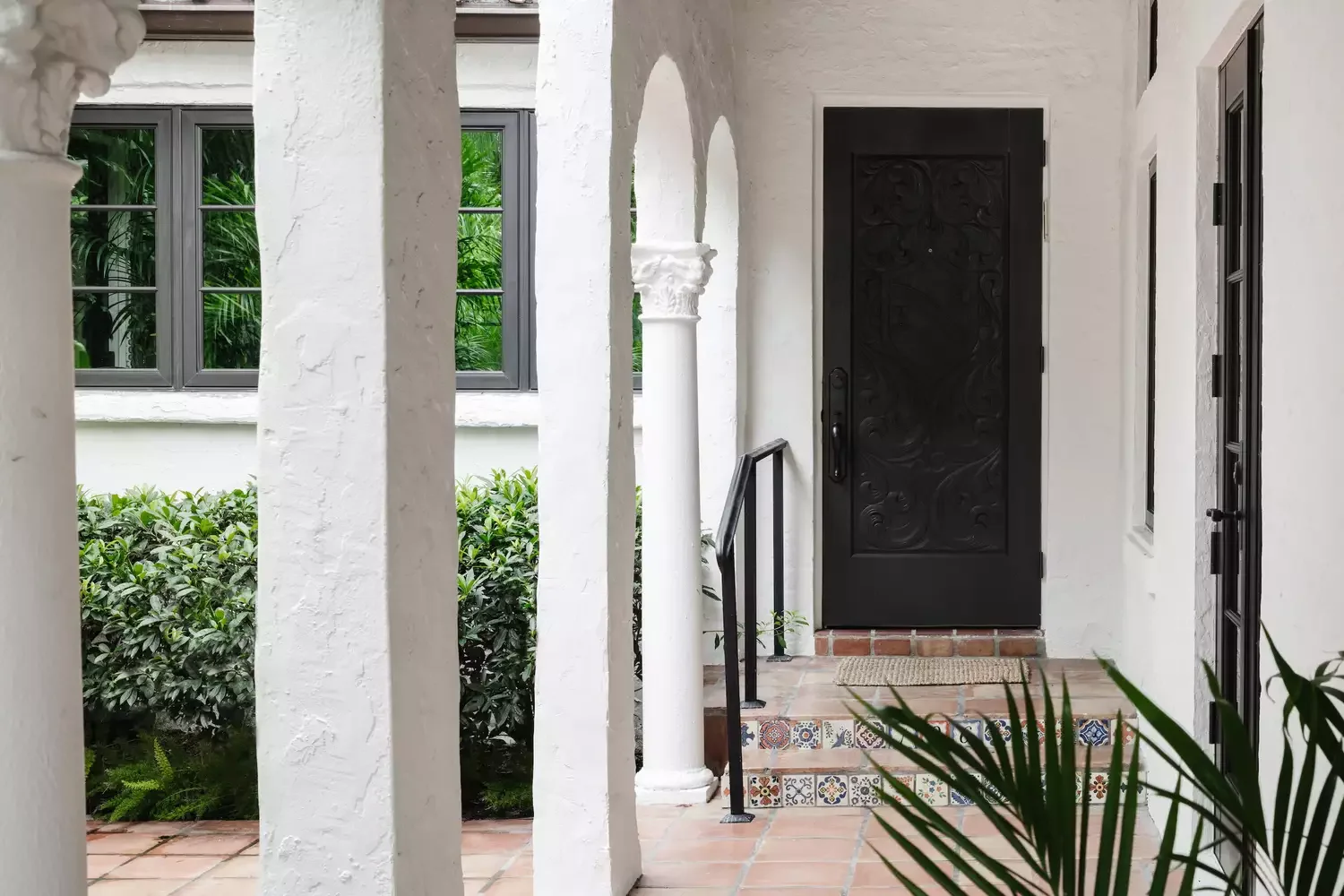 35 Stunning Black Door and White Trim Combinations That Create Perfect High-Contrast Drama 15 Carved Black Front Door
