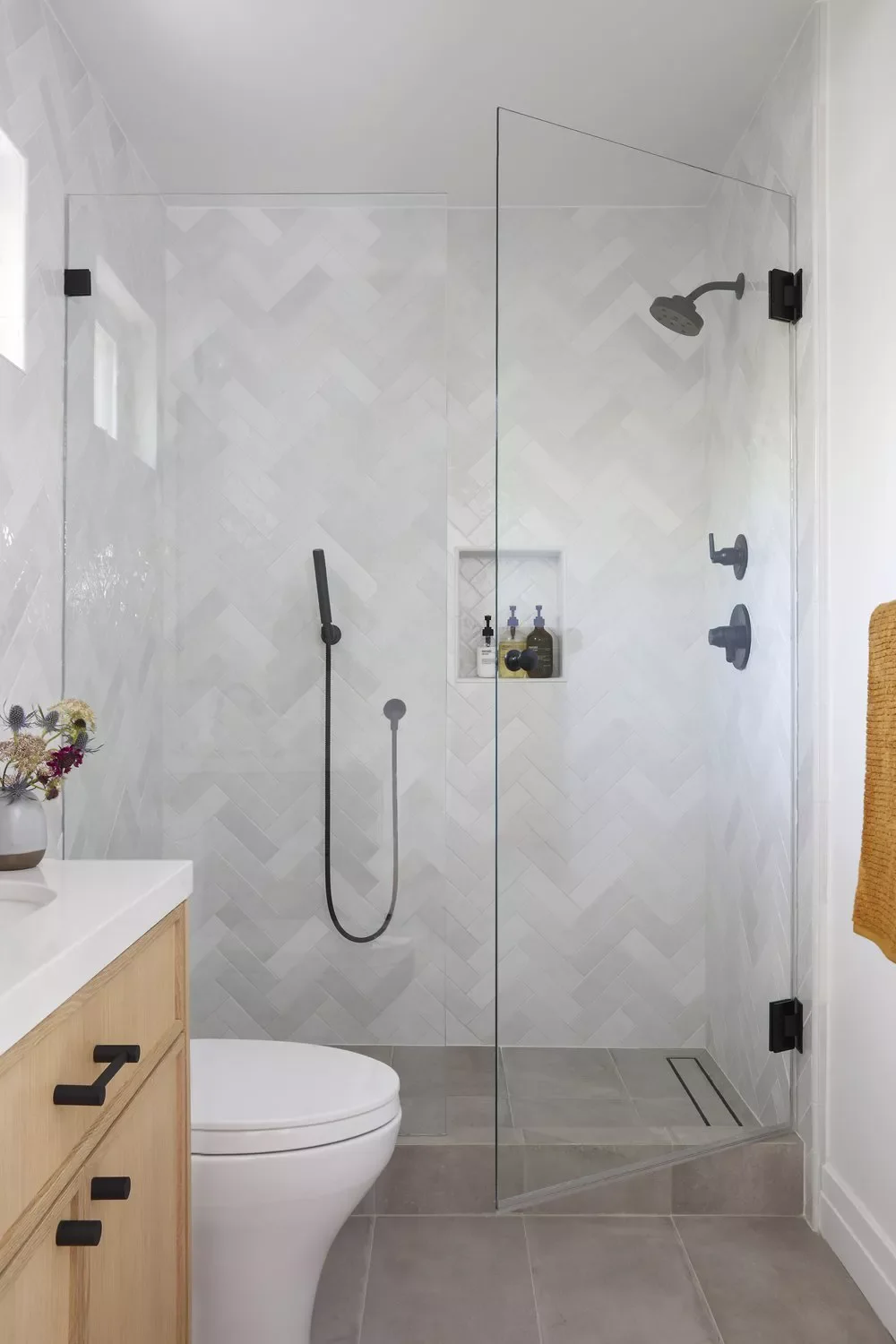 26 Beautiful Walk-In Shower Ideas to Transform Your Small Bathroom 10 Choose a Chevron Tile Arrangement