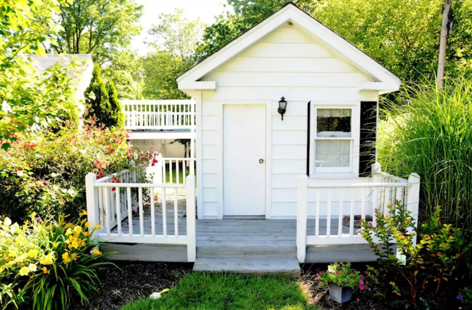 21 Inviting Guest House and Cottage Designs That Welcome Everyone 4 Classic Batten-and-Board