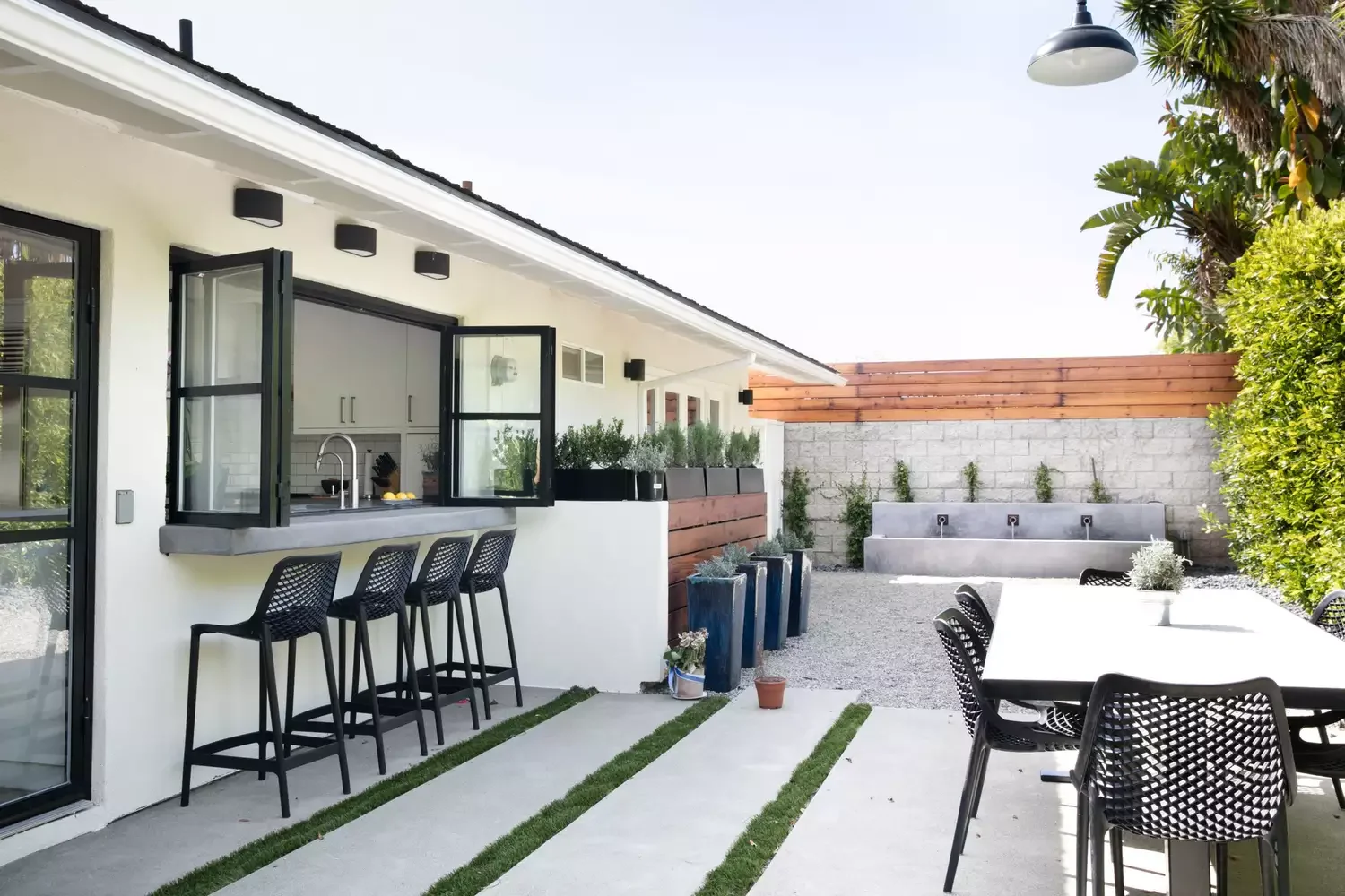 20 Stunning Grass-Free Backyard Designs That Create Lush Outdoor Retreats 1 Combine Concrete and Gravel