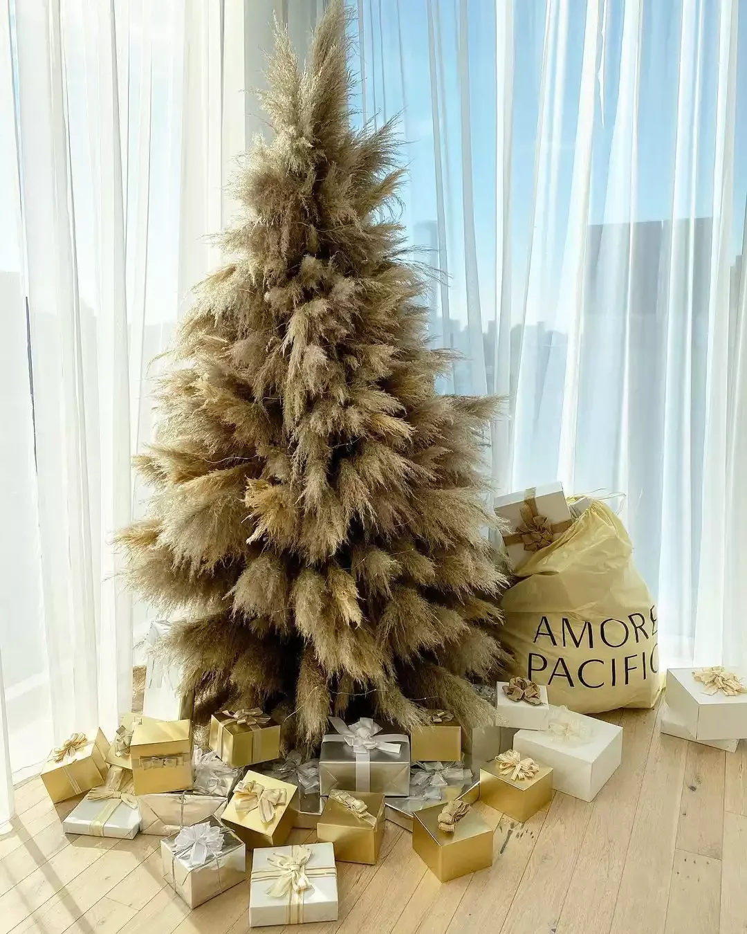 19 Stunning Pampas Grass Christmas Tree Ideas for Your Boho Holiday Style 14 Coordinate the Wrapping Paper