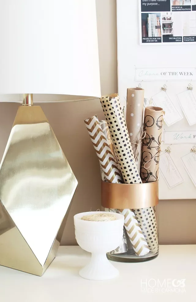 18 Creative Gift Wrap Storage Solutions That Banish Holiday Clutter Corral Small Rolls in a Glass Jar