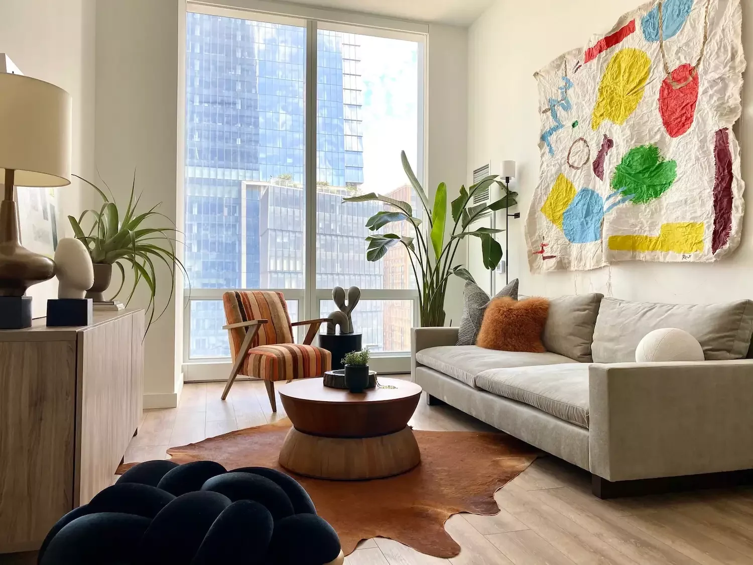 12 Classic Living Room Arrangements That Never Go Out of Style Couch + Chair + Pouf