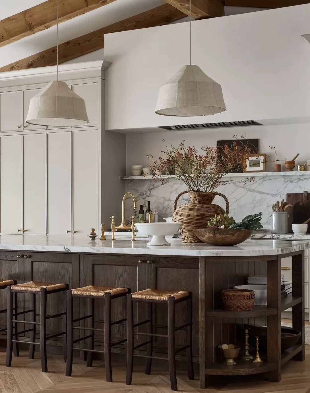 Cream Cabinets With Dark Wood Island and Herringbone Floors