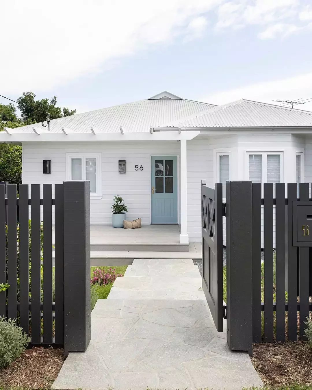 31 Stunning Front Yard Fence Ideas That Will Transform Your Home's Curb Appeal Create Chic Contrast Between Fence and Home