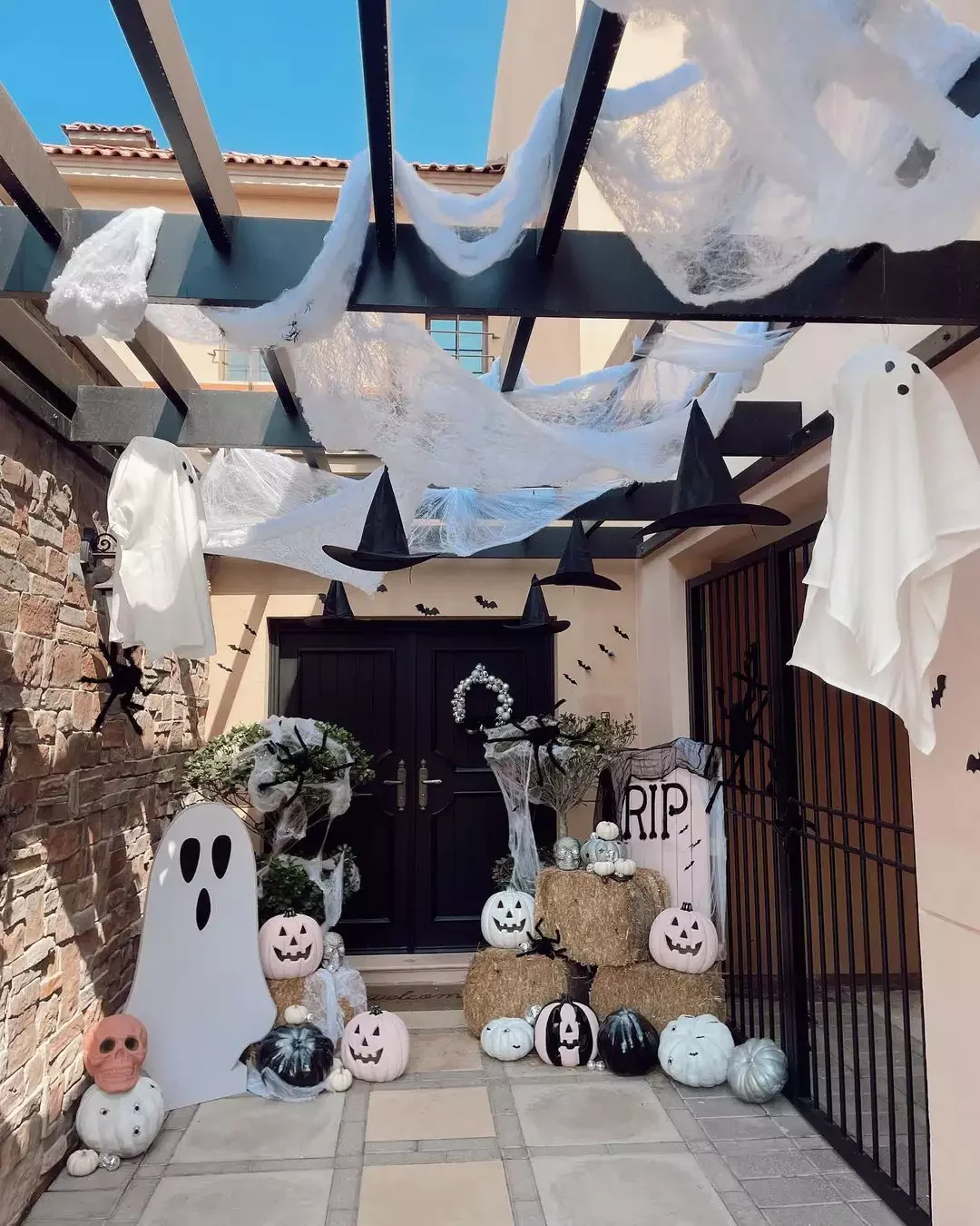 33 Spooktacular Halloween Front Porch Ideas That'll Make Your Home the Neighborhood's Must-See Destination 16 Create Depth With Height Variance