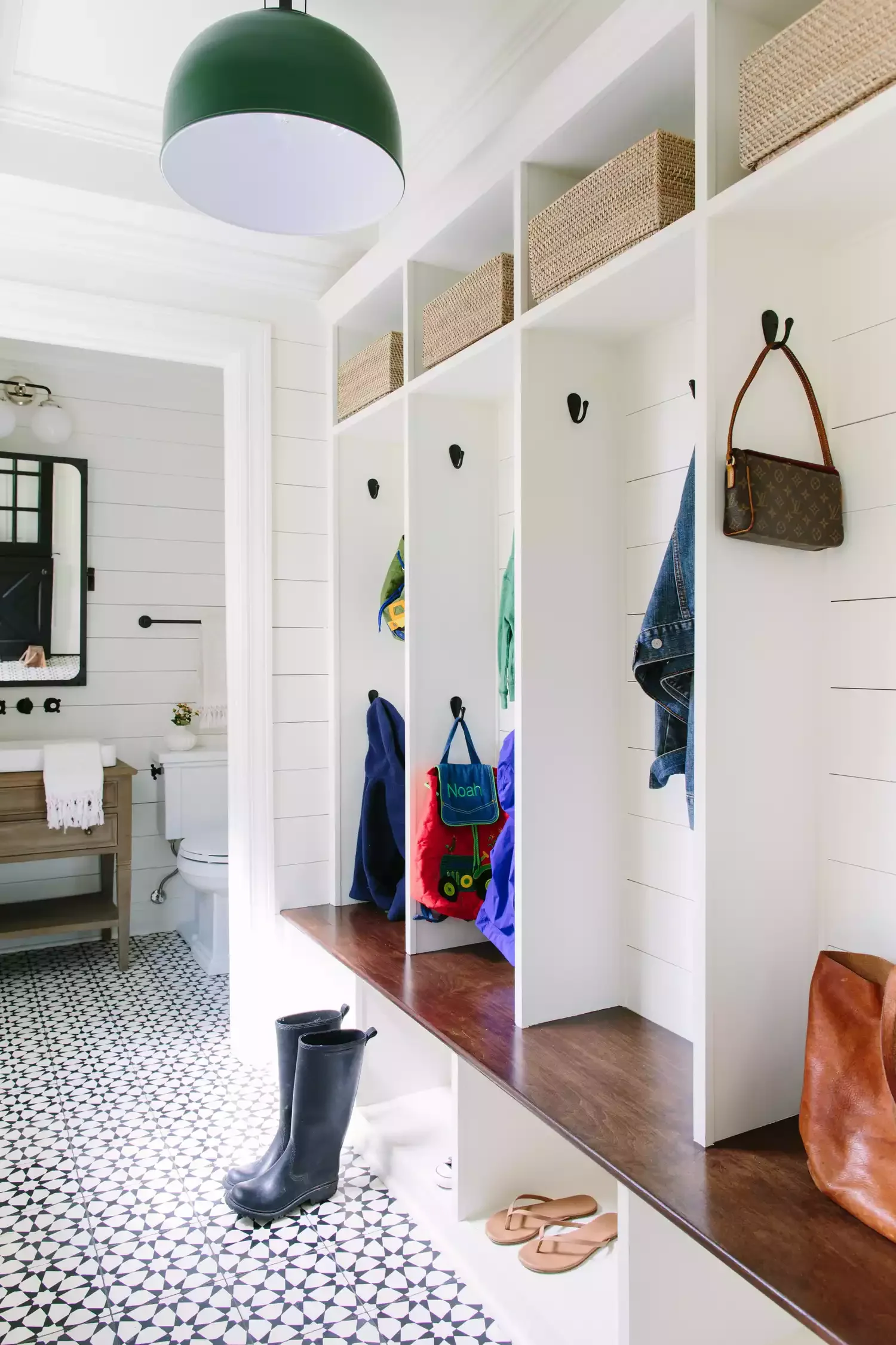 22 Stunning Floor-to-Ceiling Shelf Ideas That Maximize Style and Storage Create Storage Near an Entrance