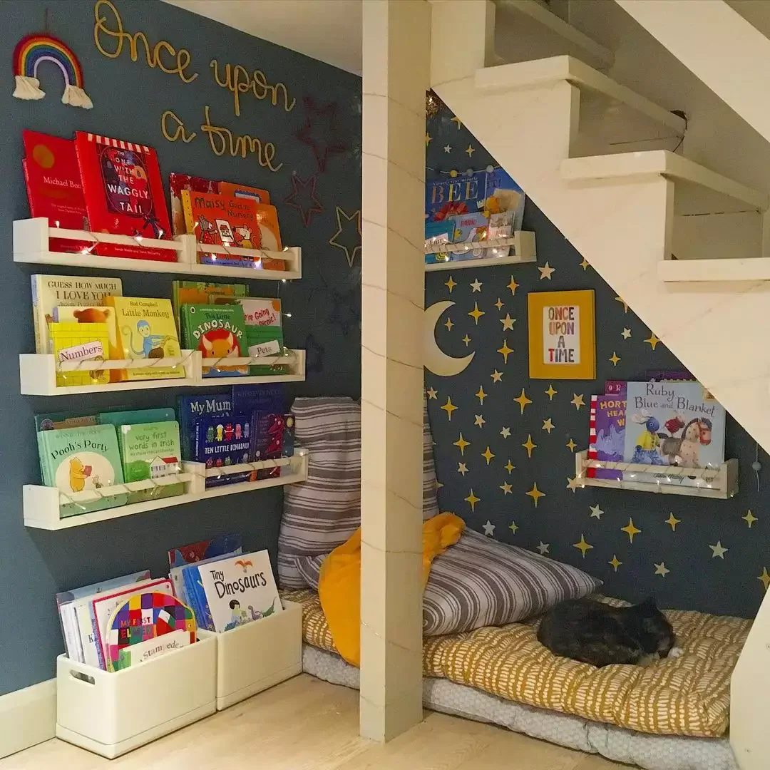 Creative Ways to Display Your Book Collection Throughout Your Home Create a Nook Under the Stairs