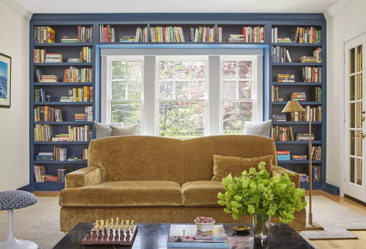 20 Beautiful Living Room Shelving Ideas to Transform Your Space 18 Create a Wall-to-Wall Bookshelf