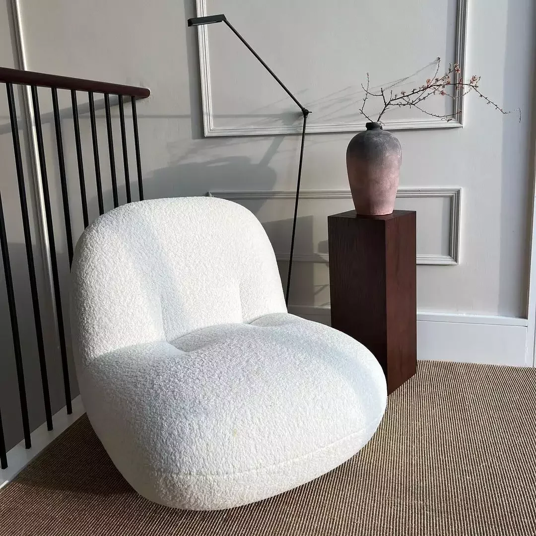 24 Creative Staircase Landing Decorating Ideas to Transform Your Space 10 Curl Up in a Soft Chair