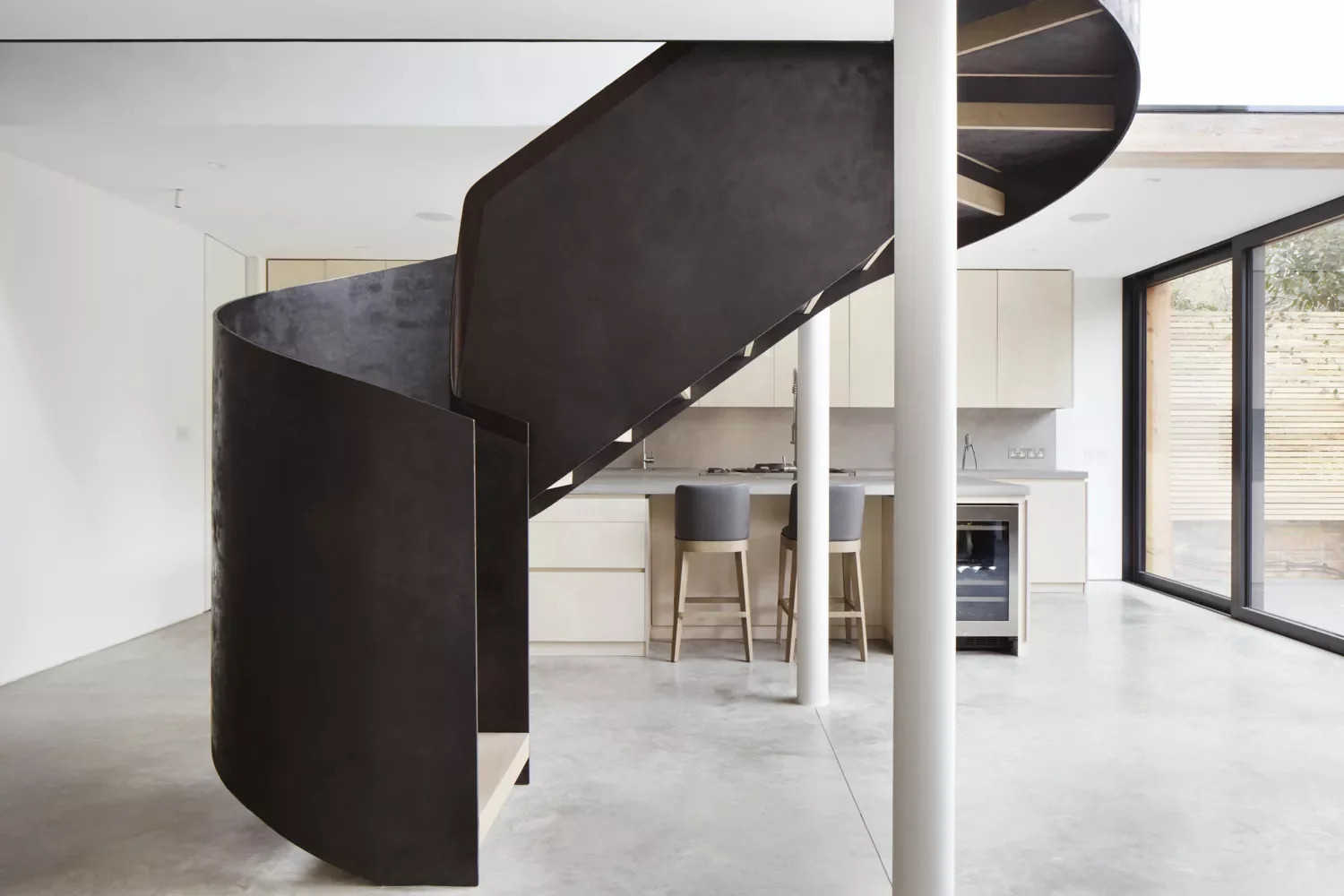 34 Stunning Stair Railing Designs That Transform Your Home 29 Curved Custom Steel Stairs