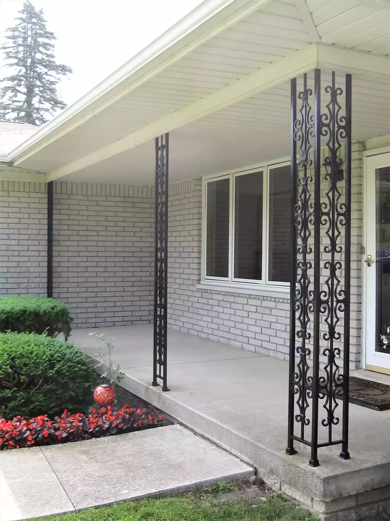 20 Stunning Front Porch Column Designs to Transform Your Home's Curb Appeal 19 Customize Wrought Iron Columns