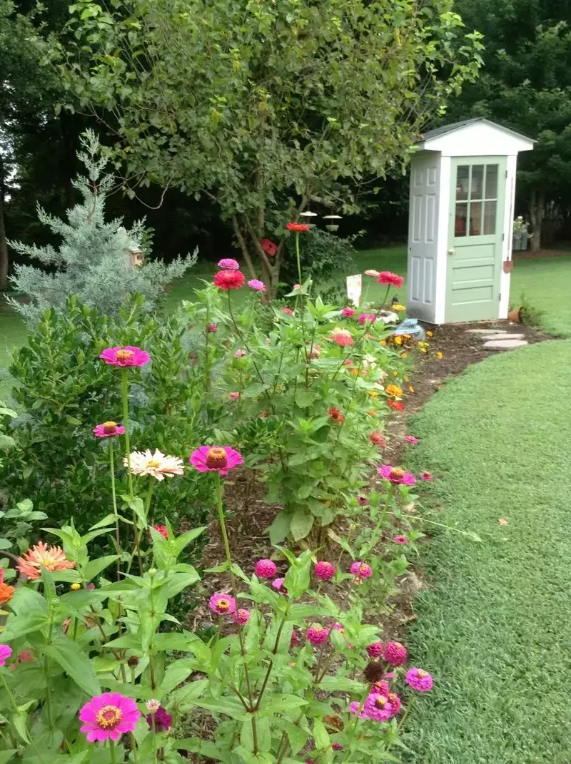 22 Stunning Garden Shed Ideas to Transform Your Backyard Into a Personal Sanctuary DIY Four-Door Shed
