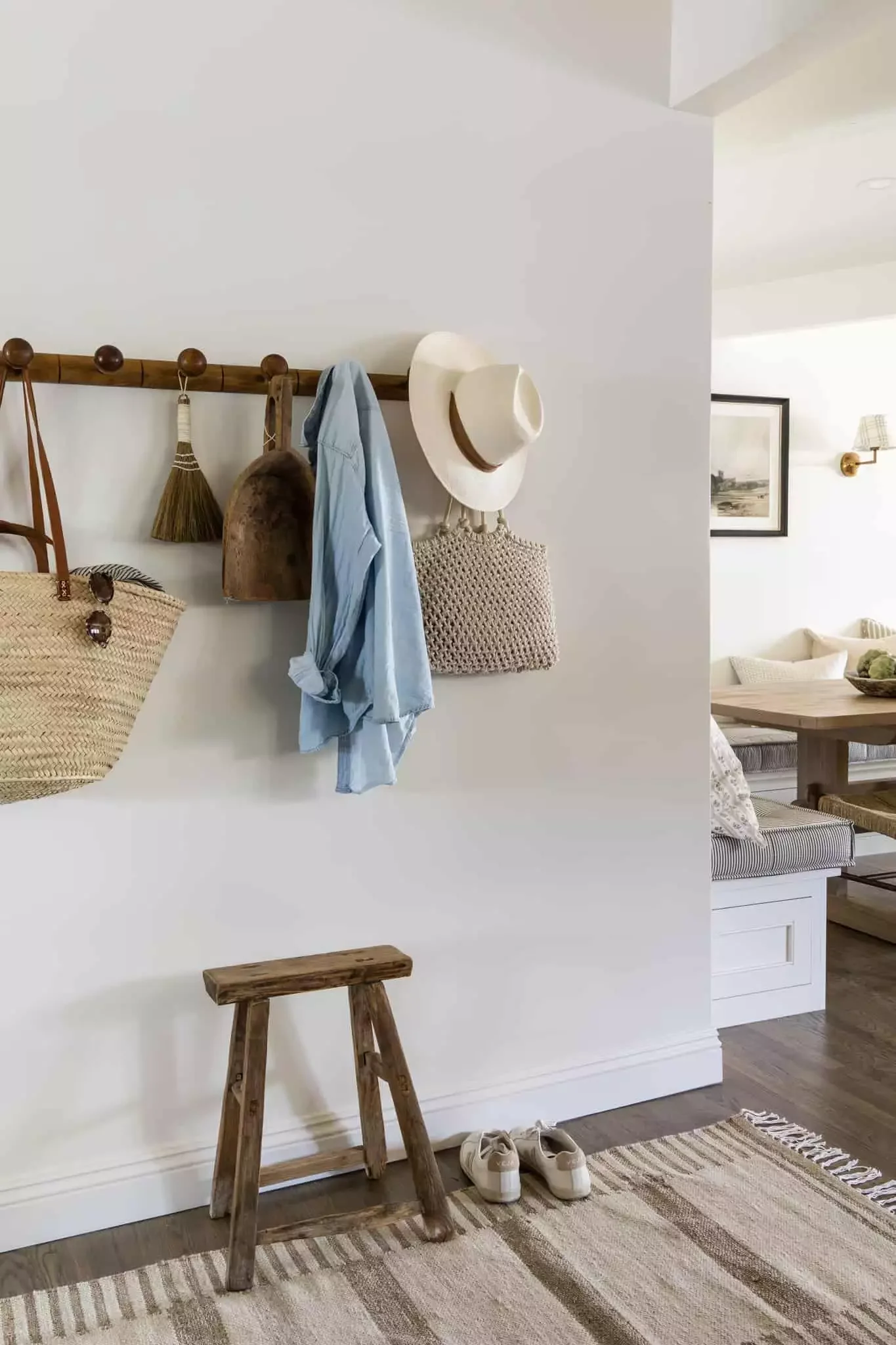 51 Cozy Farmhouse Wall Decorating Ideas That'll Transform Your Space 36 Dark Wood Peg Rail