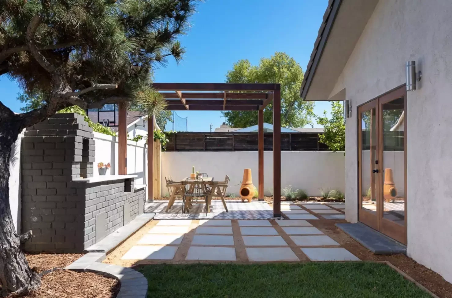 31 Stunning Pergola Ideas to Transform Your Backyard Into a Stylish Retreat 7 Dark Wood Pergola
