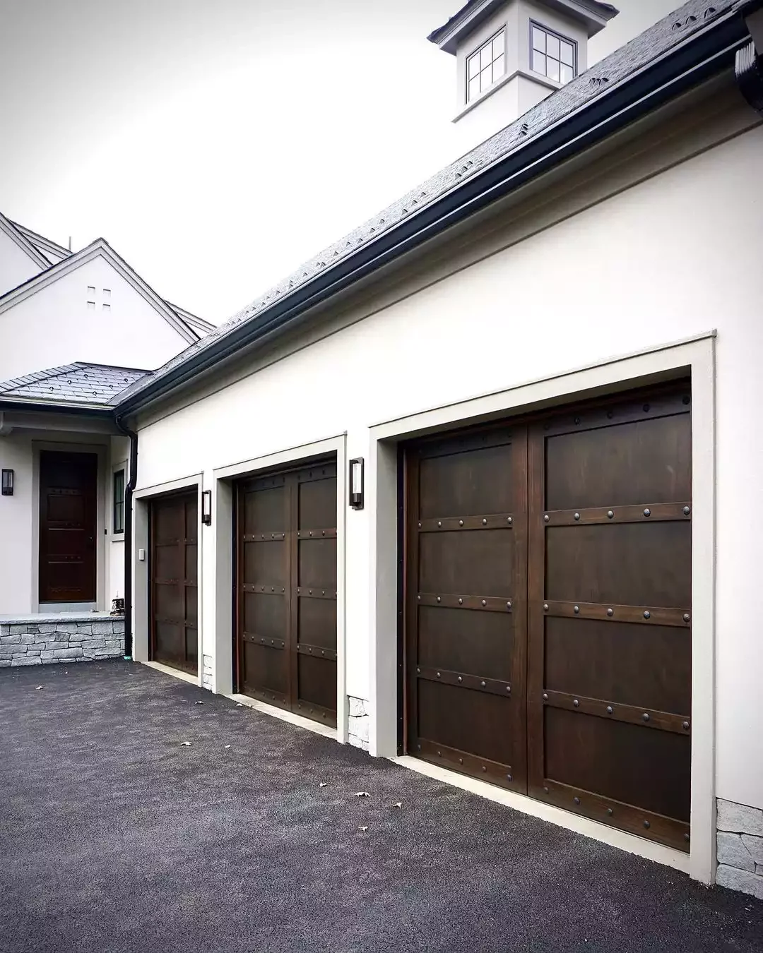 52 Stunning Garage Door Ideas That Will Transform Your Home's Curb Appeal Dark Wood With Decorative Clavos