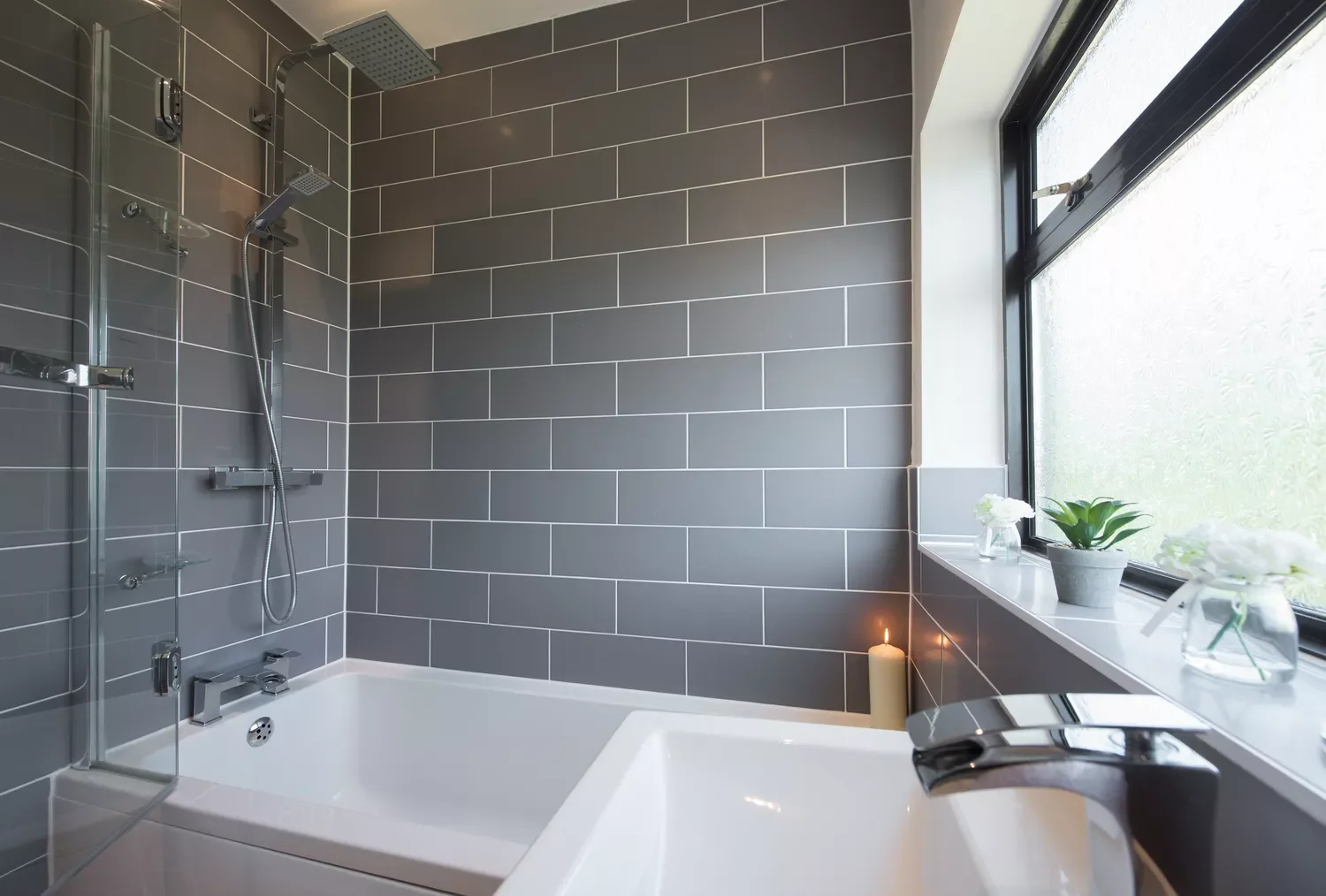 25 Stunning Gray Tile Ideas to Transform Your Bathroom Into a Showstopper 4 Darken Your Subway Tiles