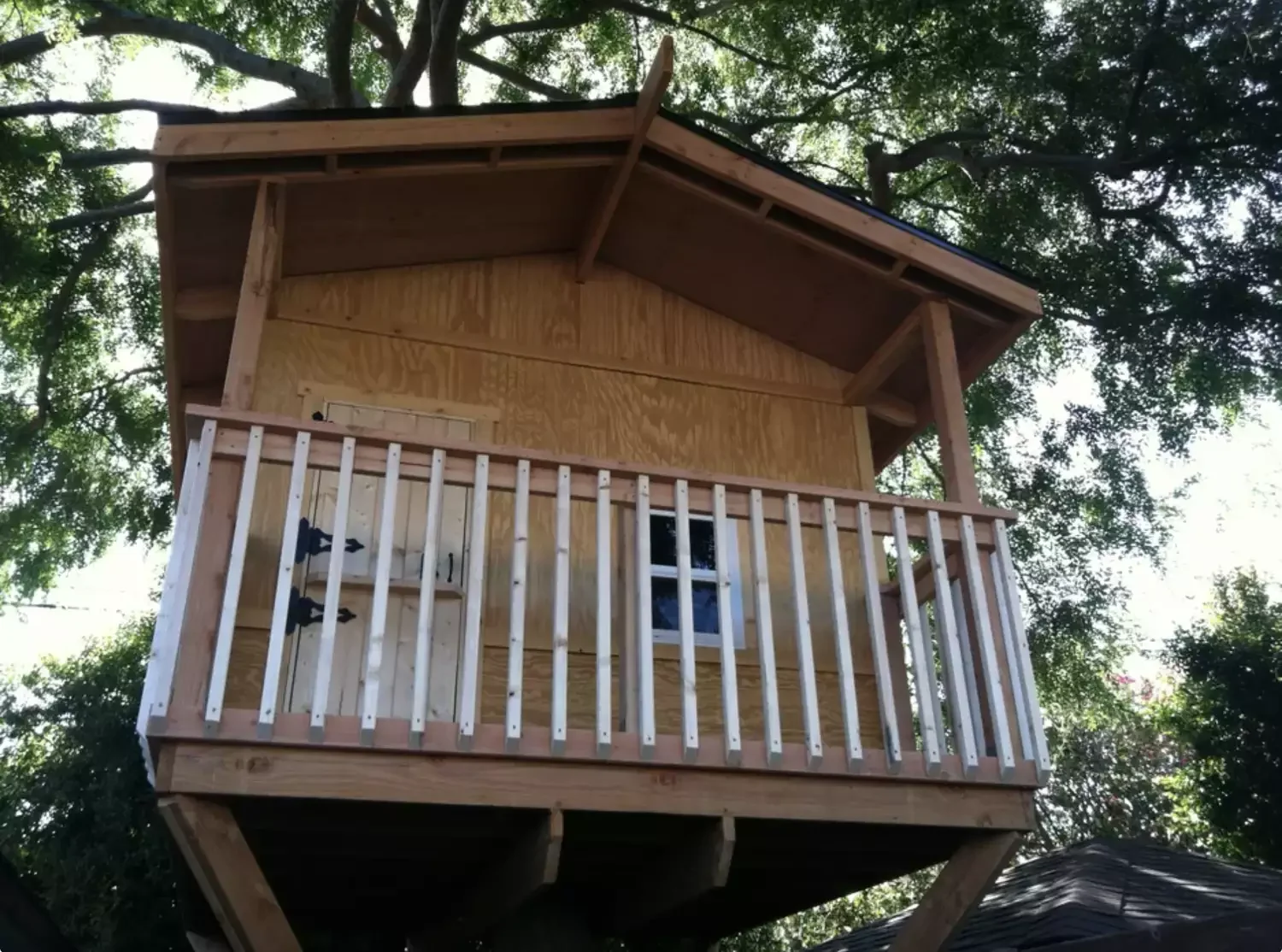 28 Amazing Treehouse Design Ideas That Will Transform Your Backyard 26 Design a Treehouse With Porch