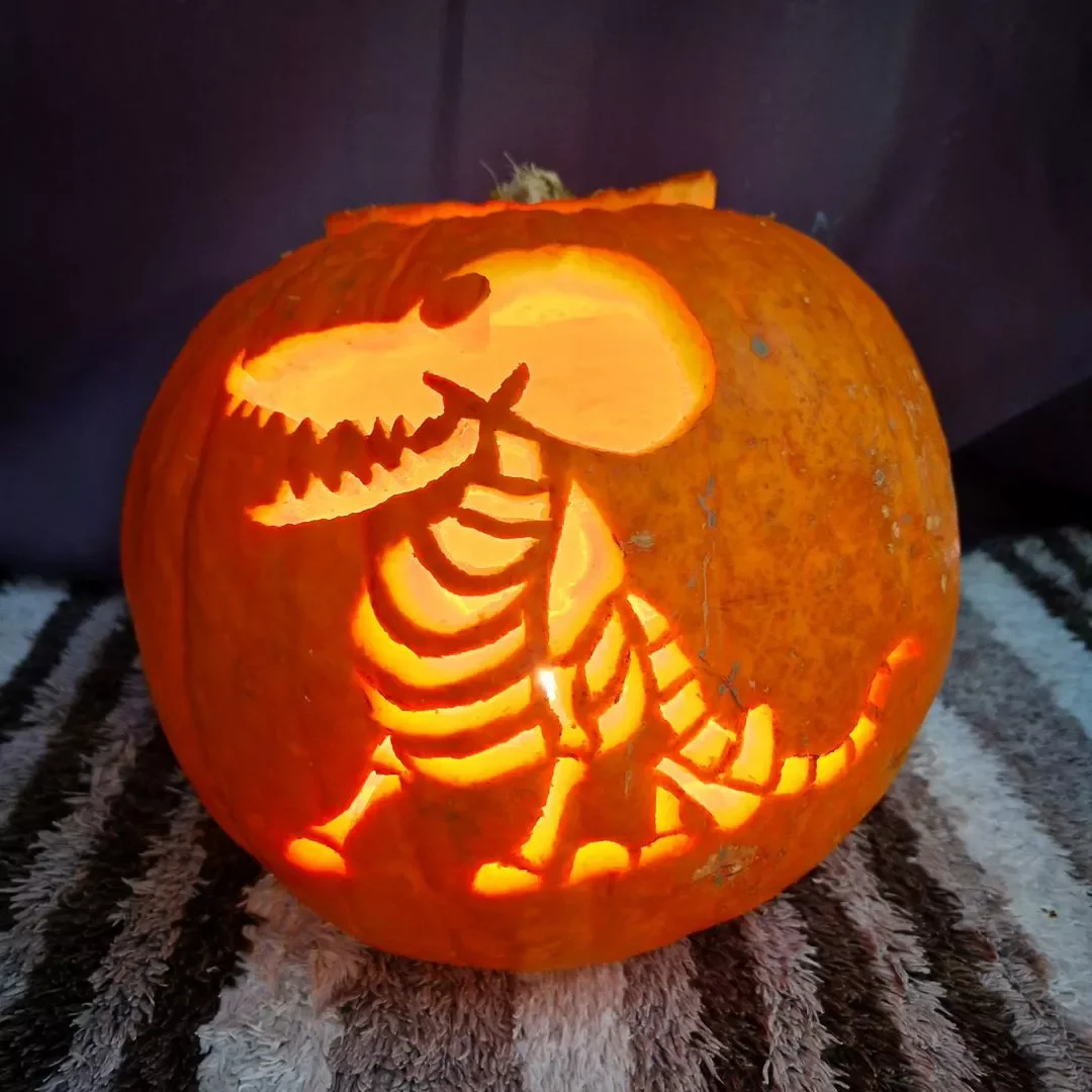 77 Creative Pumpkin Carving Ideas That'll Transform Your Fall Decorating Game 26 Dinosaur Pumpkin