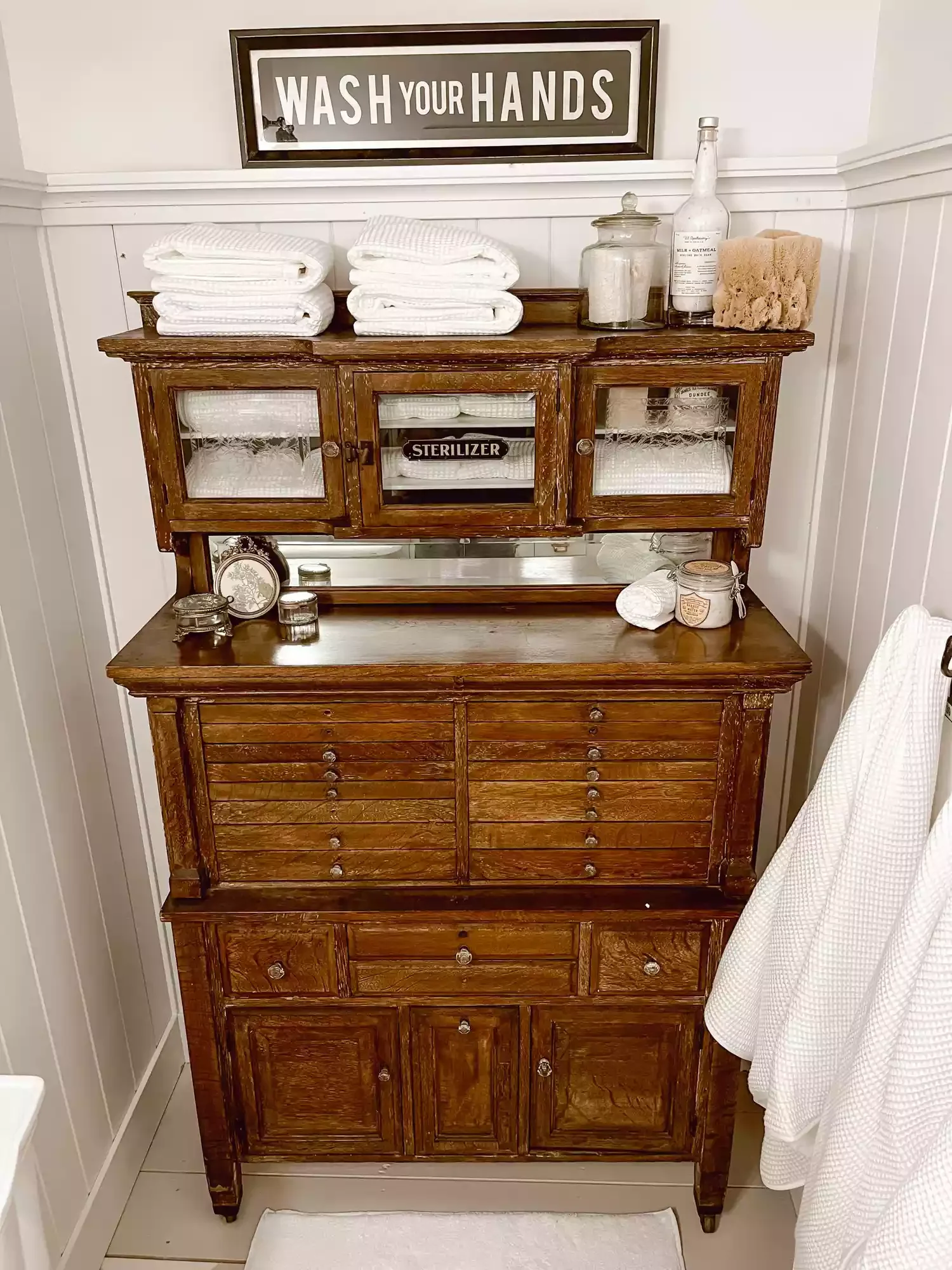 30 Bathroom Wall Decor Ideas That Refresh Your Space This Year Display a Vintage Sign