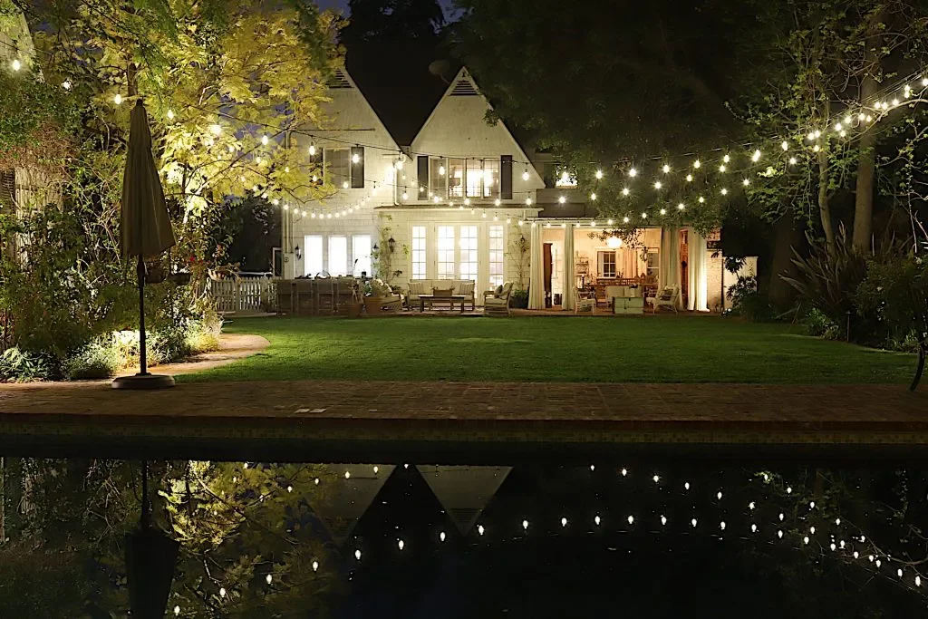 26 Backyard Lighting Ideas That Completely Transform Outdoors Draped String Lights