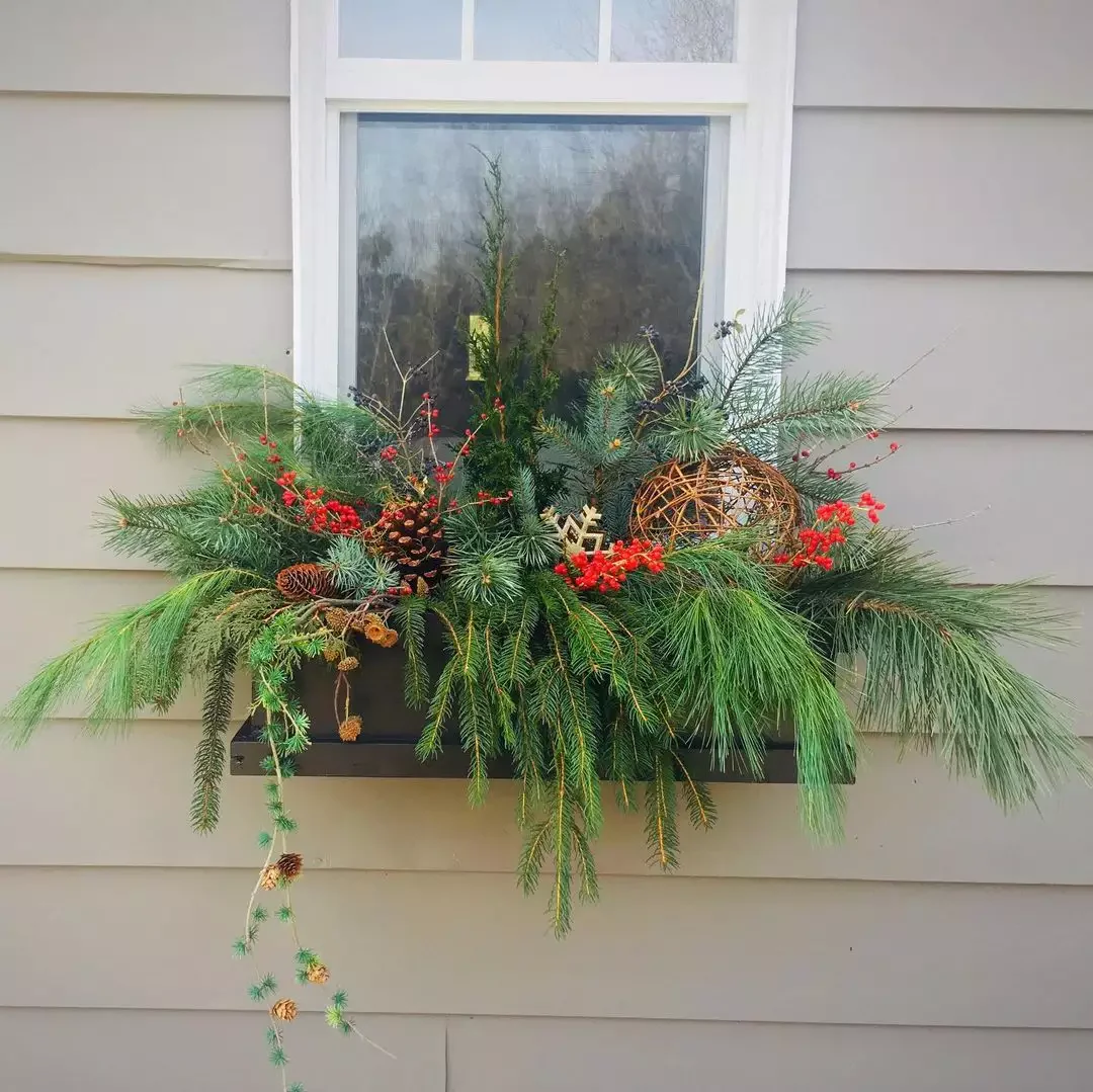13 Stunning Winter Window Box Designs That'll Transform Your Home's Curb Appeal 1 Draping Evergreen Boughs