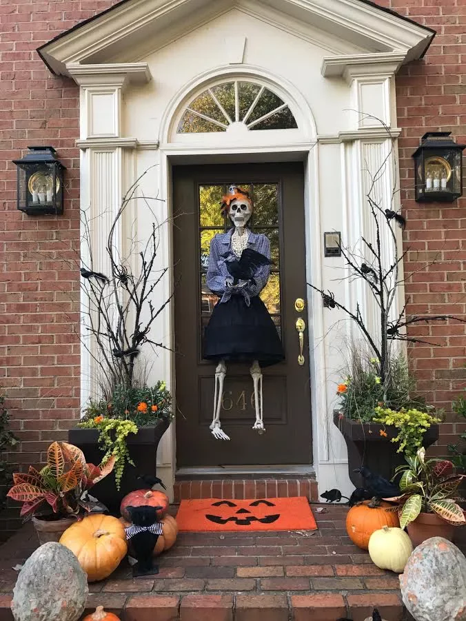 42 Quick Halloween Door Decorations You Can Create in Under an Hour 38 Dressed Skeleton Door Hanger