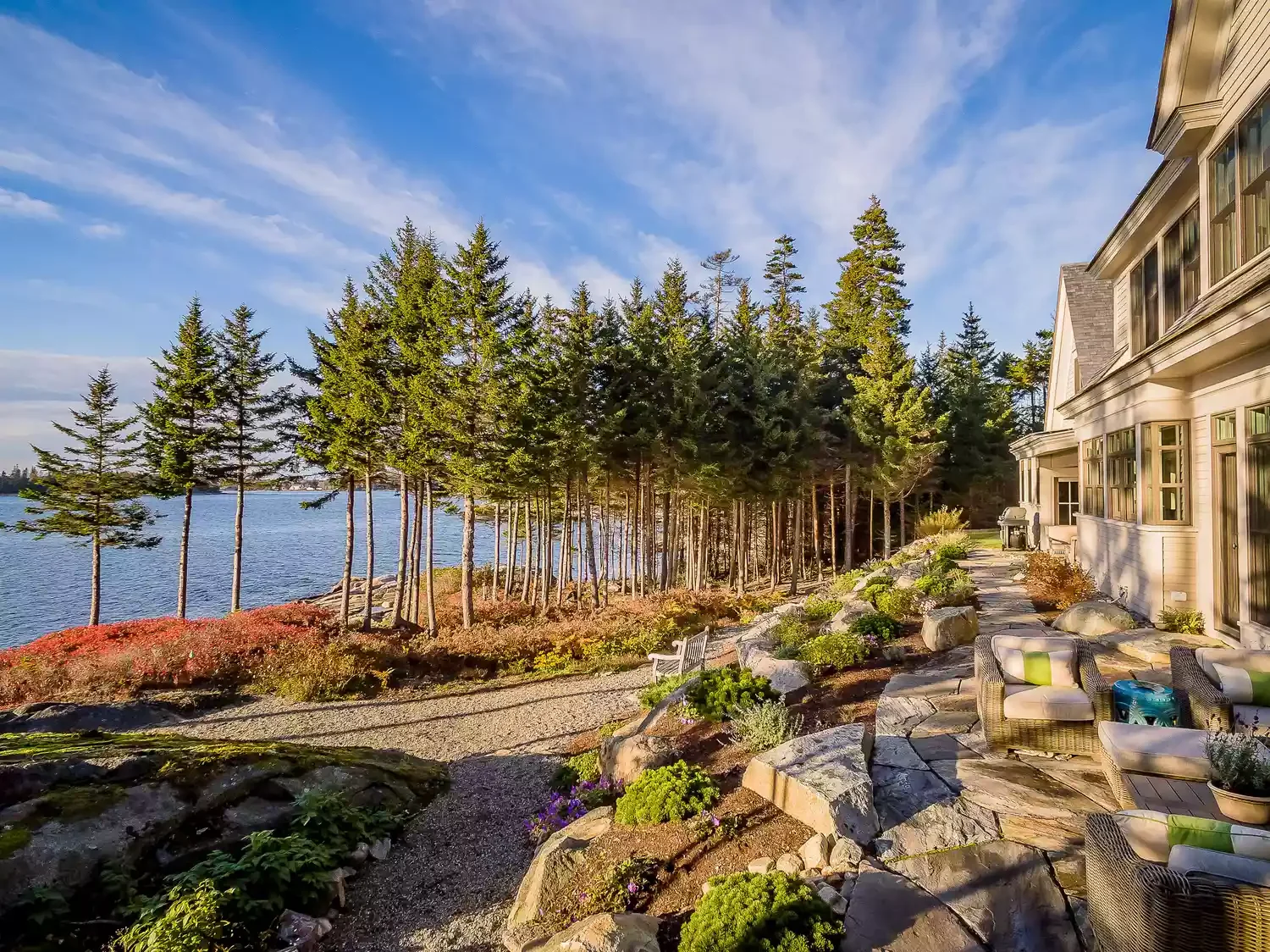 54 Small Patio Ideas That Will Transform Your Outdoor Space Edge With a Stone Wall