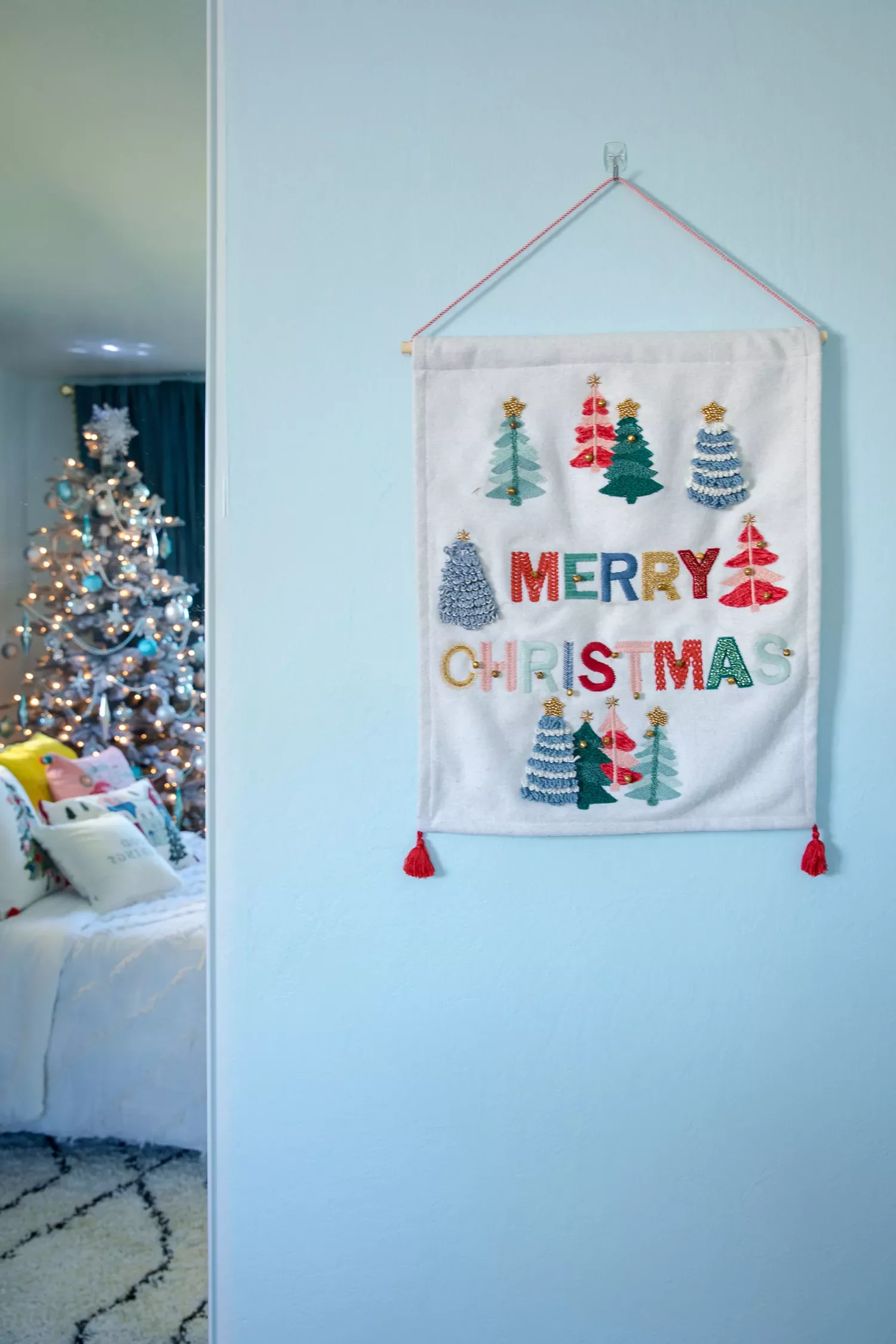 32 Stunning Christmas Wall Decorating Ideas to Transform Your Home Into a Holiday Haven 31 Embroidered Wall Hanging