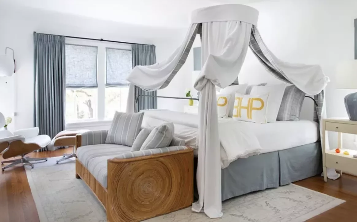 34 Bedroom Chair Ideas That'll Transform Your Space From Boring to Beautiful 18 End-of-Bed Couch and Eames Chair