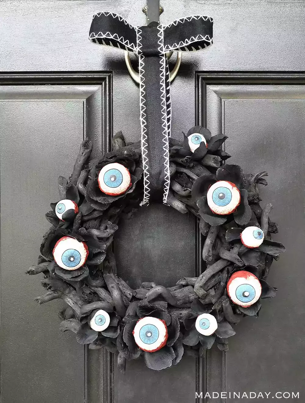 42 Quick Halloween Door Decorations You Can Create in Under an Hour 14 Eyeball Wreath