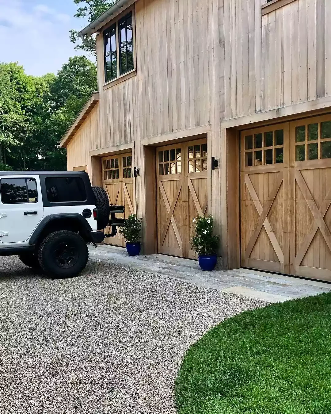 52 Stunning Garage Door Ideas That Will Transform Your Home's Curb Appeal Farmhouse-Style Red Cedar Doors