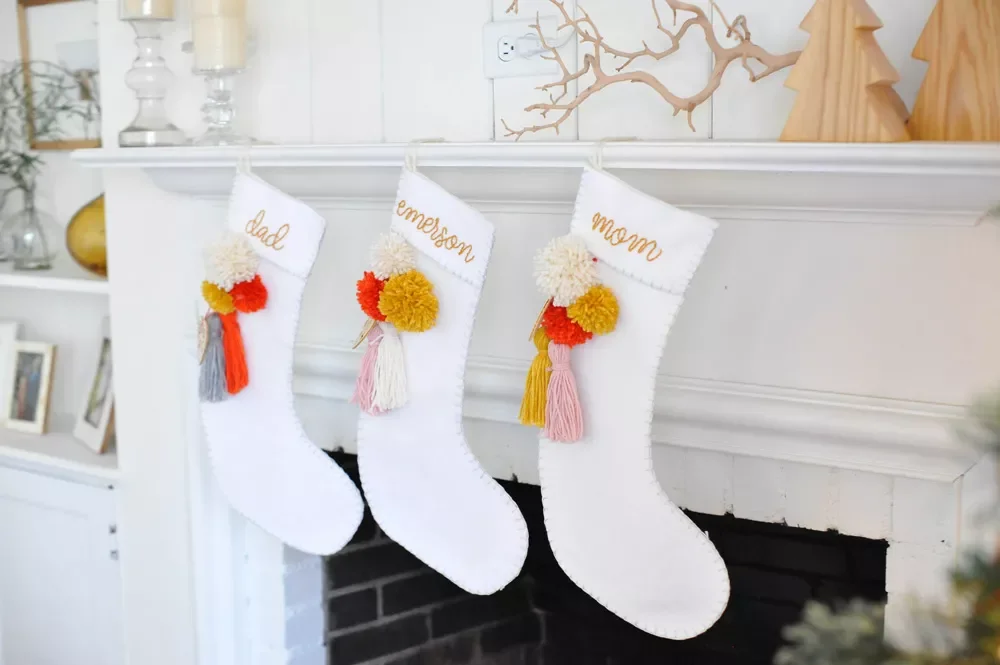41 Creative DIY Christmas Stocking Ideas That Will Transform Your Holiday Decor 4 Felt Stockings With Tassels and Poms