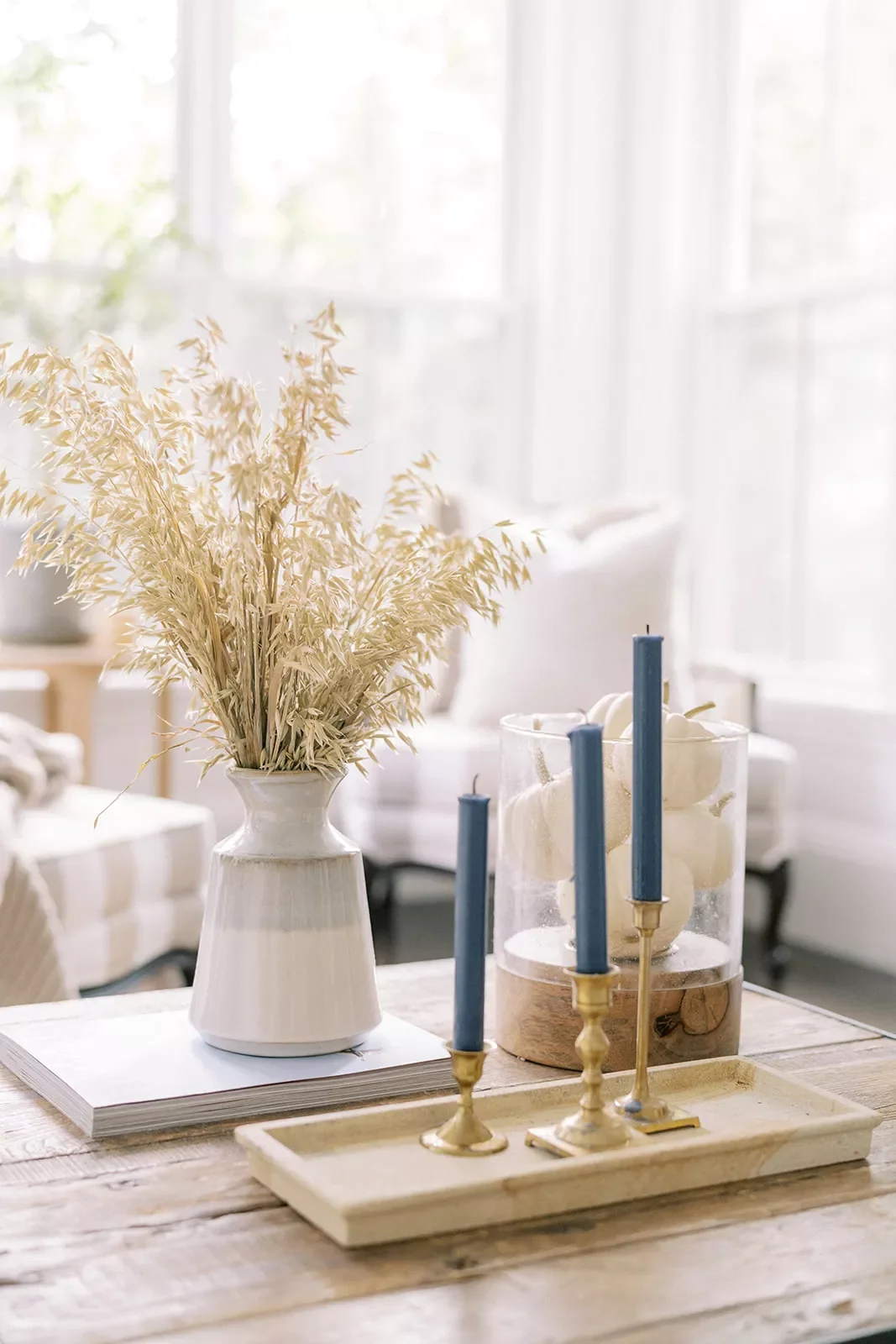 78 Beautiful Fall Table Decorating Ideas to Transform Your Seasonal Celebrations 17 Fill a Vase With Pumpkins