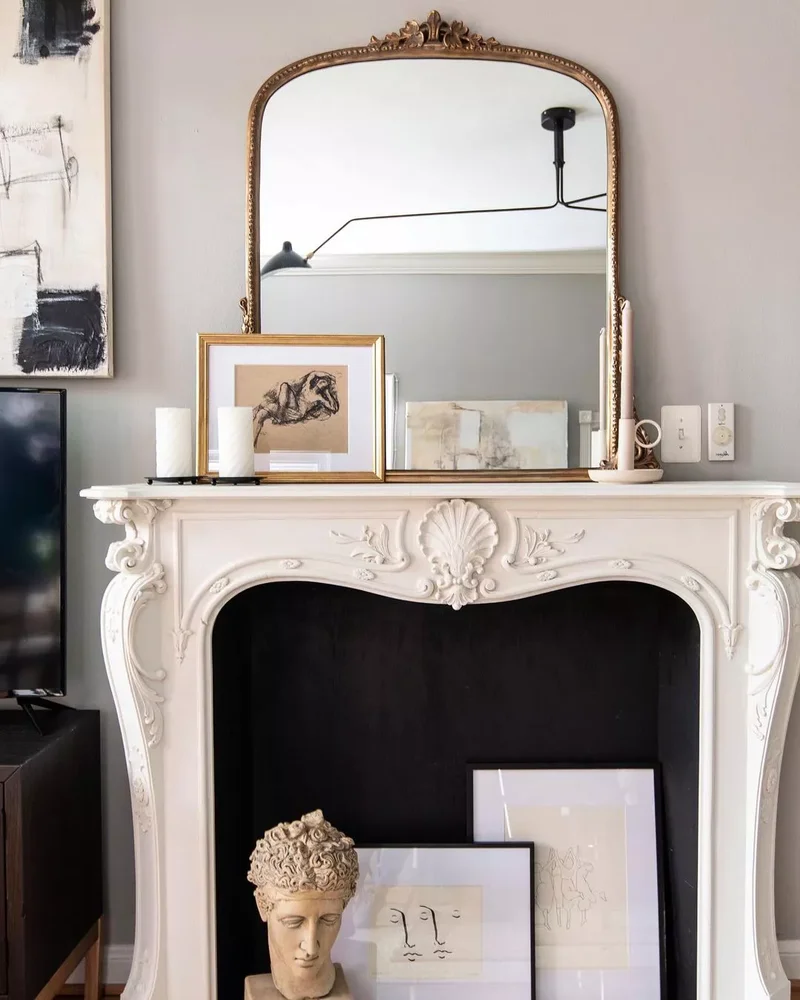 44 Beautiful Fireplace Mantel Styling Ideas 7 Fill the Firebox with Art