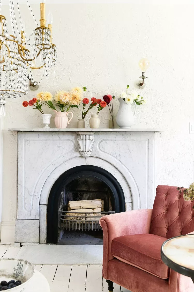 30 Beautiful Spring Mantel Ideas That Will Transform Your Living Space 1 Fresh Flowers + Vintage Vessels