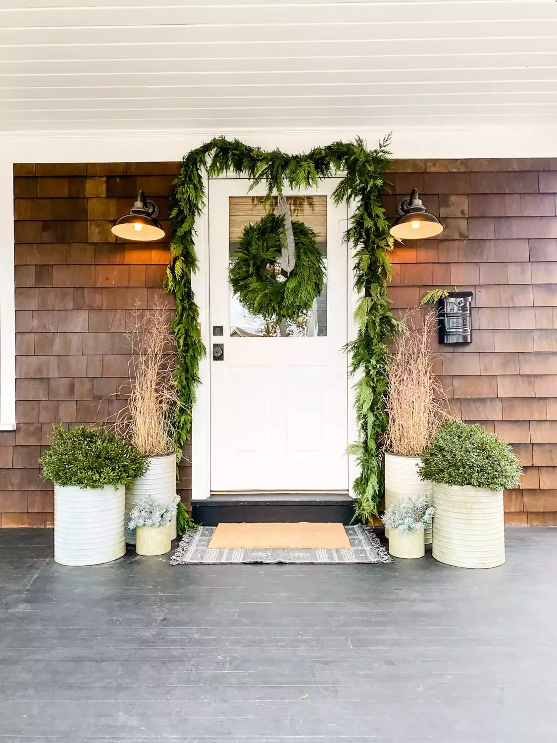 68 Christmas Front Porch Ideas That Make Your Home the Envy Fresh Greens and Dried Grass