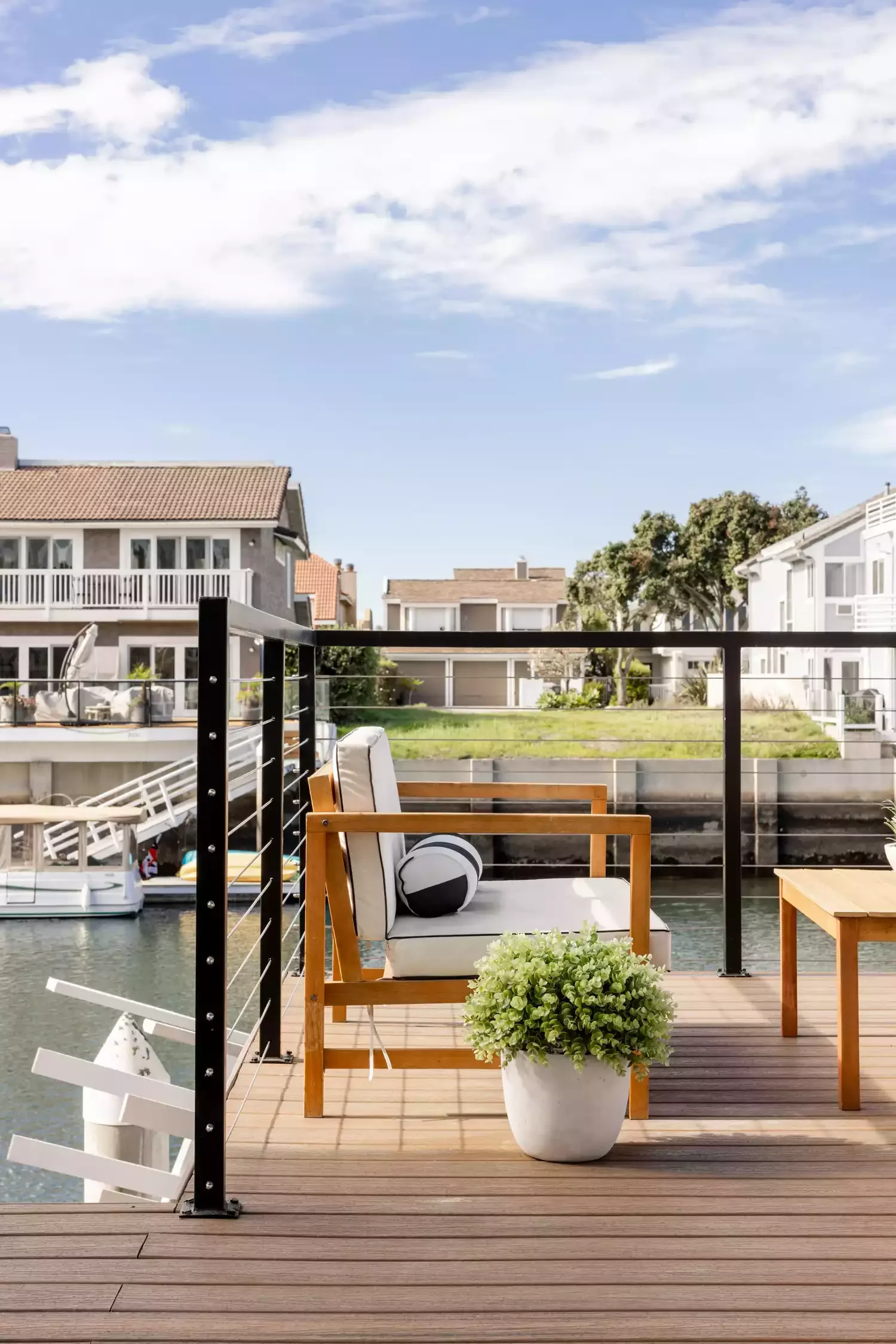 20 Stunning Grass-Free Backyard Designs That Create Lush Outdoor Retreats 7 Get Comfy by the Water