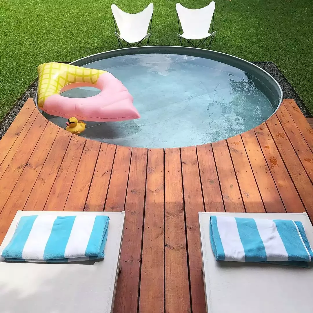 33 Creative Stock Tank Pool Ideas to Transform Your Backyard 9 Give It an Elevated Deck