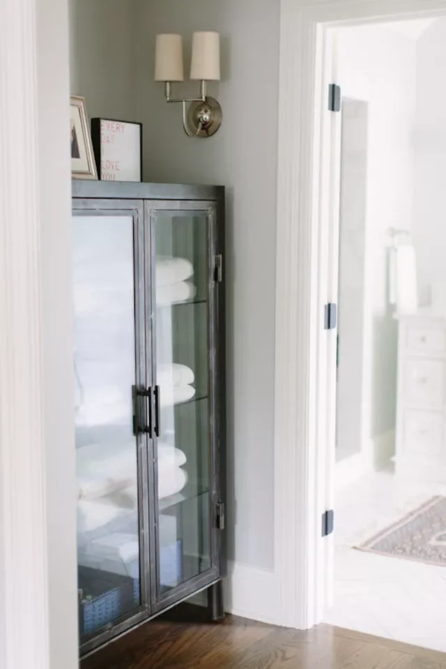 22 Smart Ways to Organize and Store Your Pillows at Home Glass-Front Cabinet