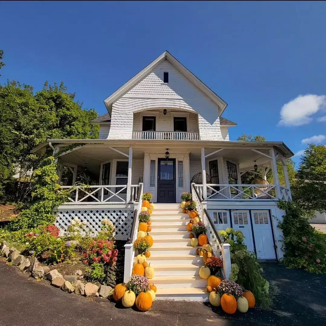 52 Autumn Front Porch Ideas That Will Transform Your Home's Entrance This Fall 1 Go All Out With the Pumpkins and Mums