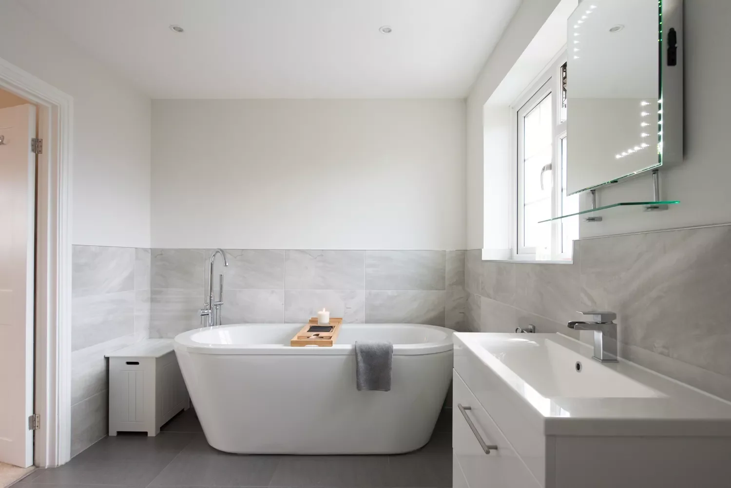25 Stunning Gray Tile Ideas to Transform Your Bathroom Into a Showstopper 14 Go Half and Half