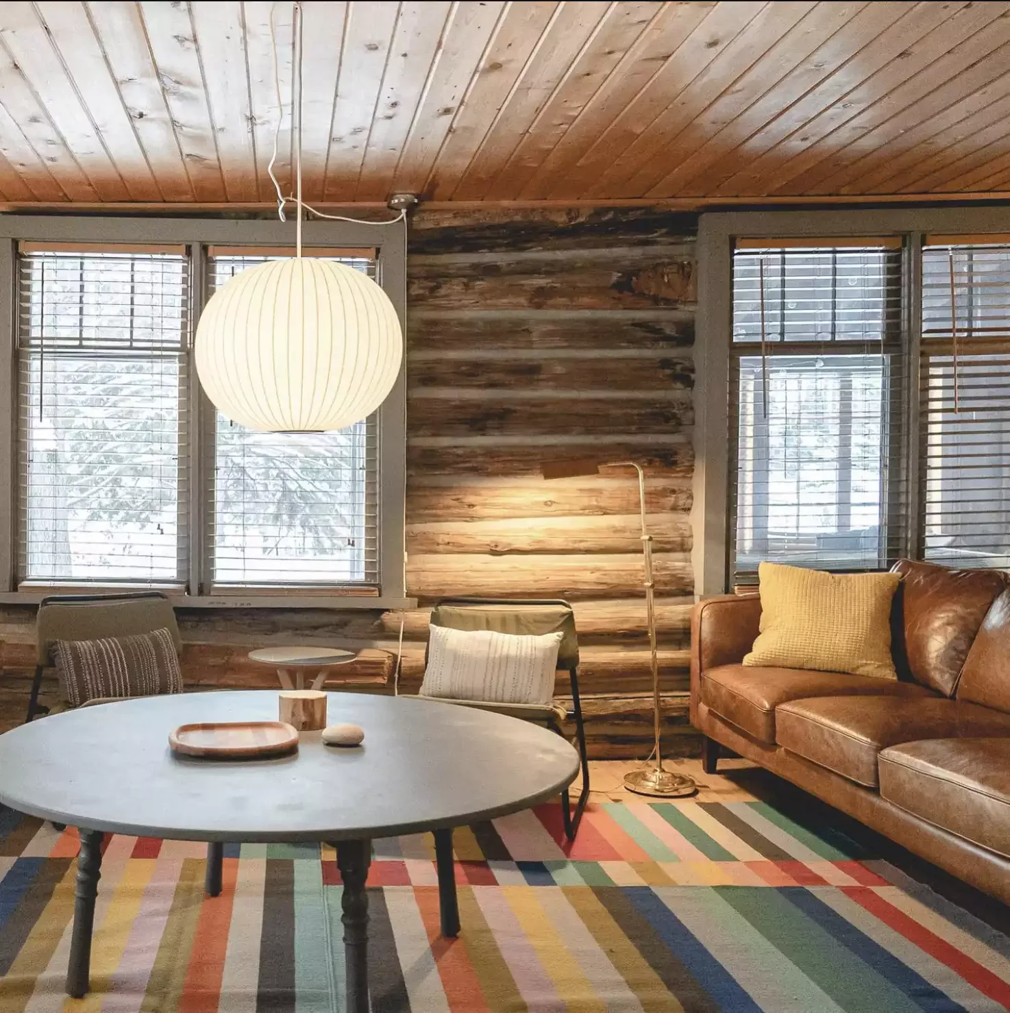 22 Fresh Ways to Give Your Log Cabin a Modern Makeover 6 Go With a Bold Rug