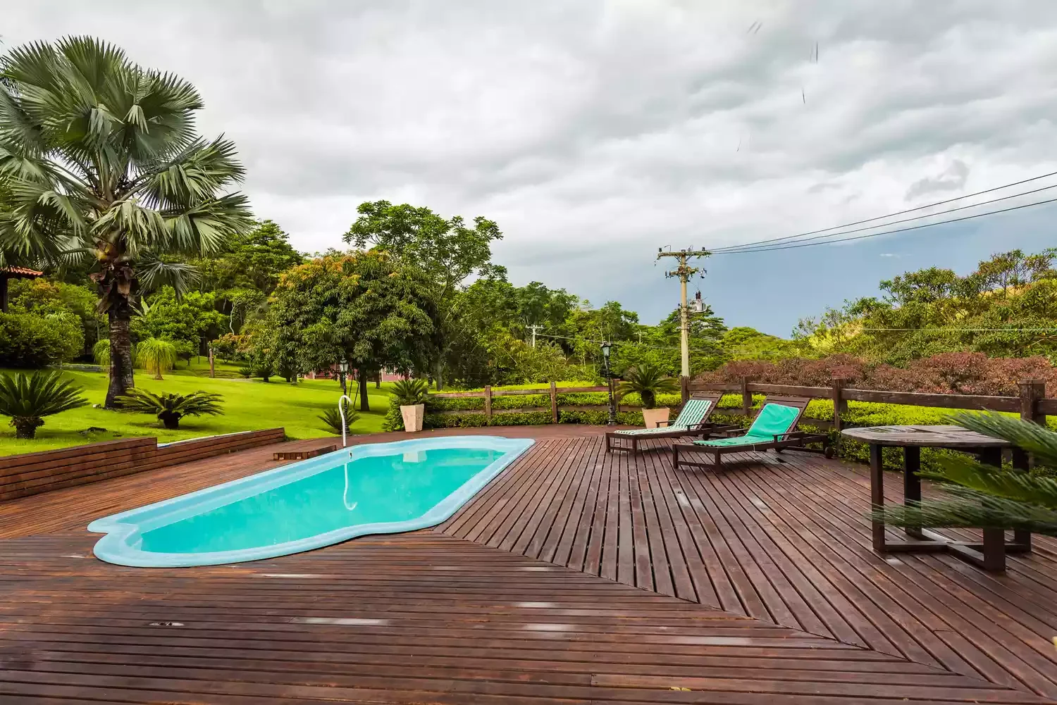 37 Brilliant Above-Ground Pool Deck Ideas That Won't Break Your Budget 5 Go With a Classic Wood Deck