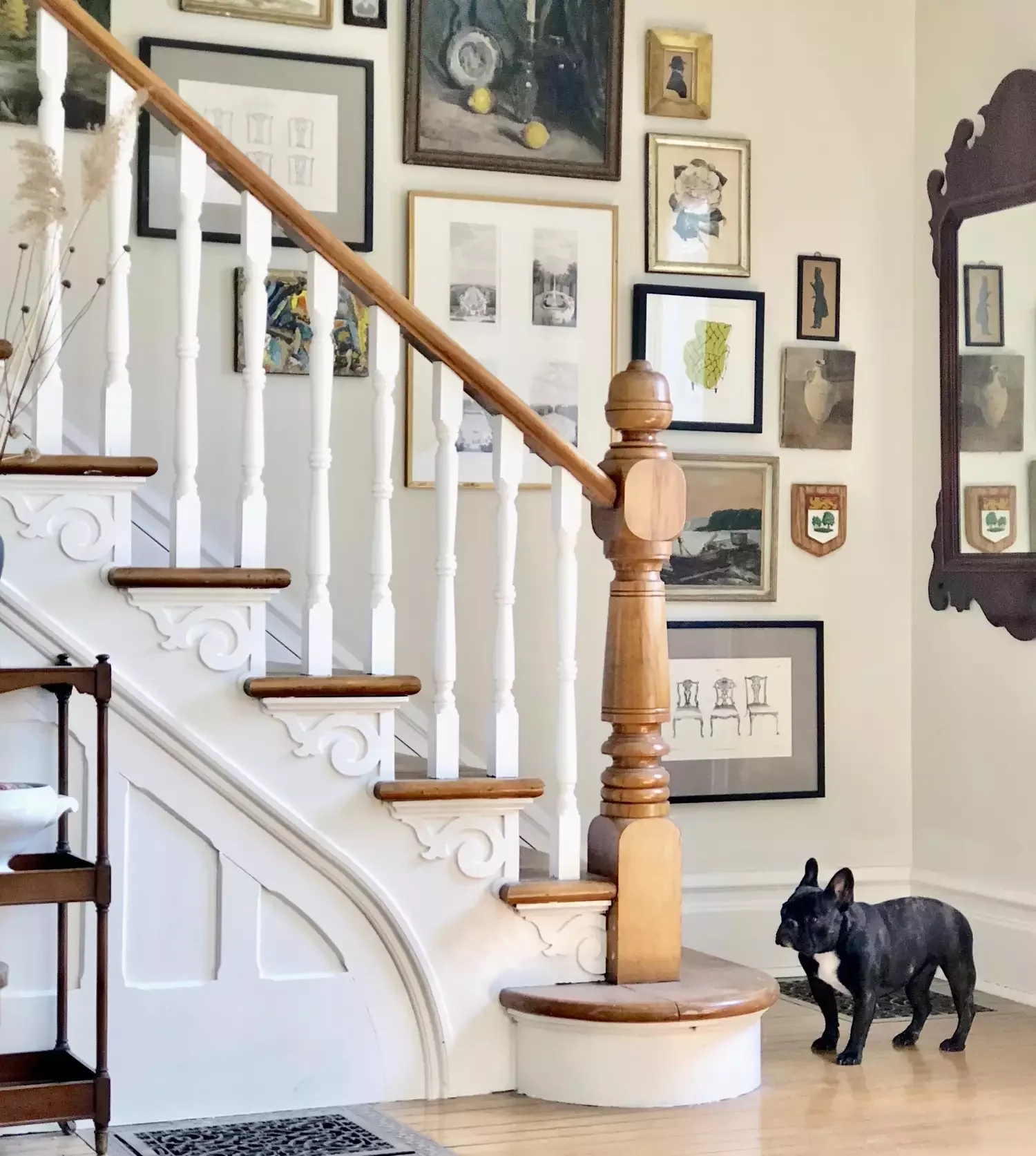 30 Creative Staircase Wall Decorating Ideas That Will Transform Your Space 14 Go for a Collected Look