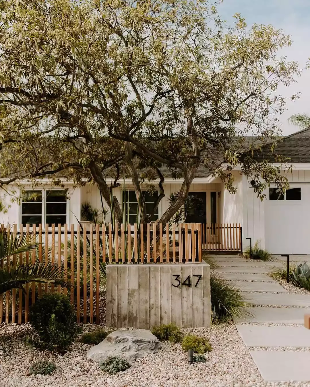 31 Stunning Front Yard Fence Ideas That Will Transform Your Home's Curb Appeal Go for a Modern Wooden Fence