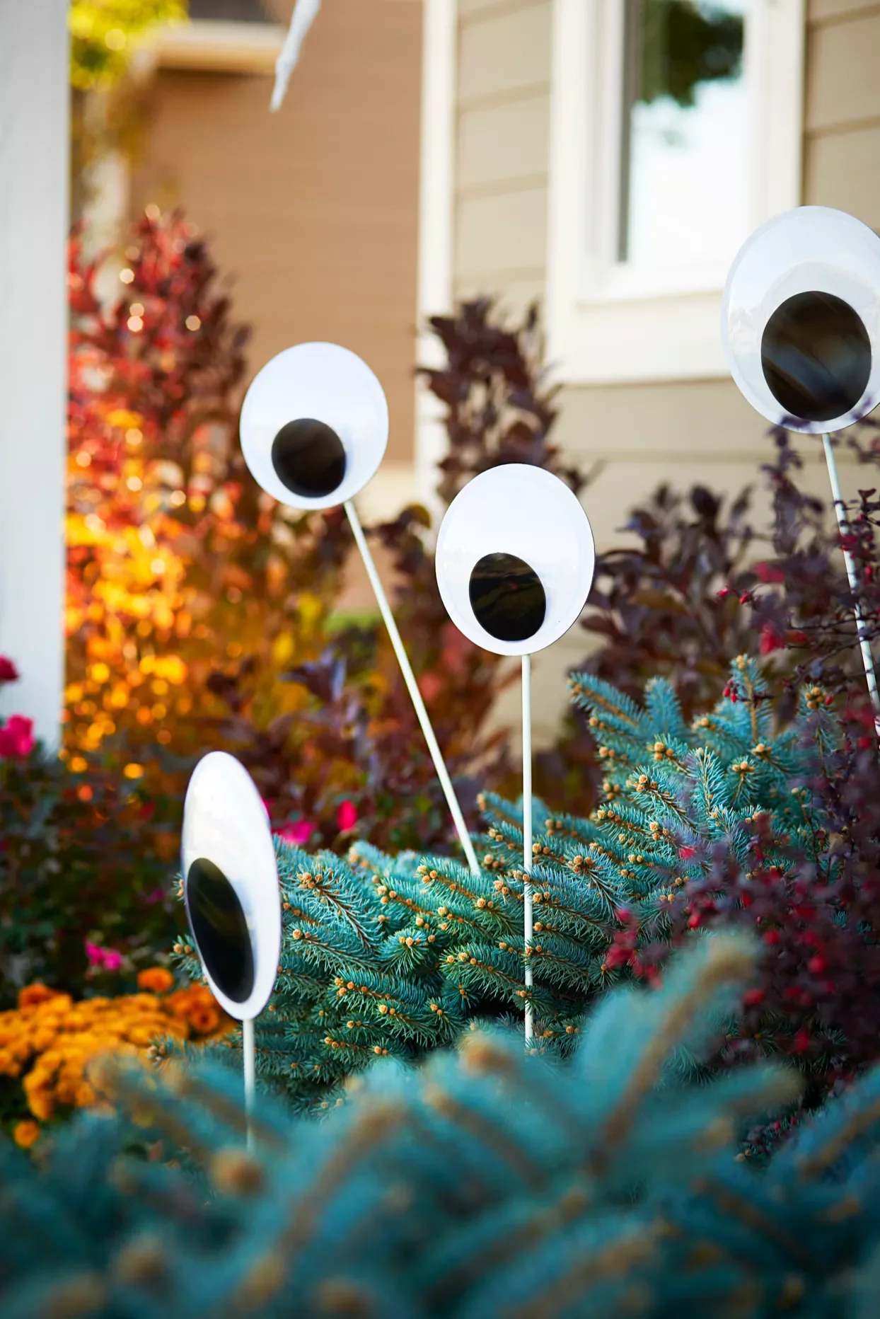 56 Creative DIY Halloween Decorations for Outdoor Spaces 29 Googly Eye Garden Stakes