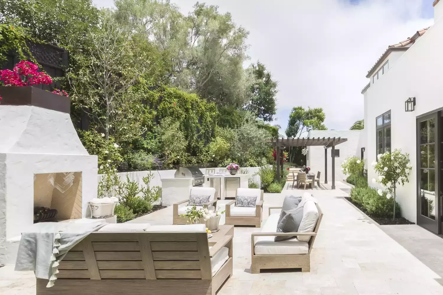 20 Stunning Grass-Free Backyard Designs That Create Lush Outdoor Retreats 3 Grab a Seat by the Fire