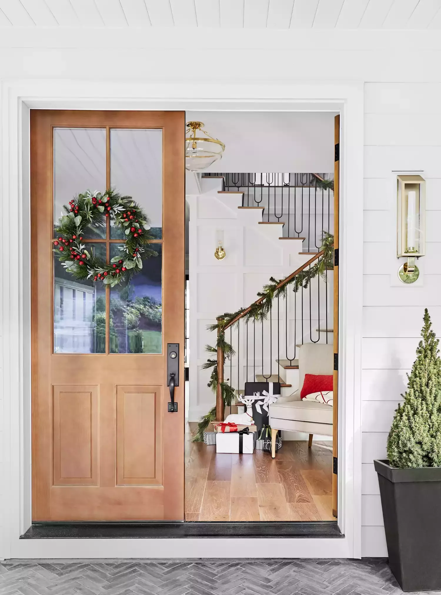 30 Christmas Door Decorating Ideas That Create Masterpieces Green Leaves and Red Berries